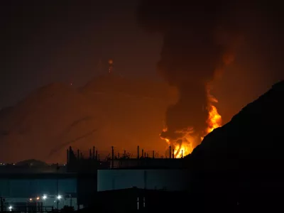 Large fire and plume of smoke is visible after, according to the authorities, debris of an Iranian intercepted drone hit the Fujairah oil facility, in Fujairah, United Arab Emirates, Tuesday, March 3, 2026. (AP Photo/Altaf Qadri)