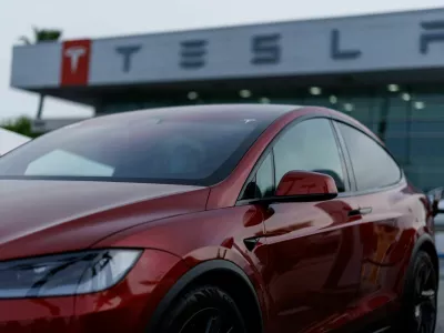 A Tesla model Y is shown charging at a Tesla dealership in Buena Park, California, U.S., January 28, 2026. REUTERS/Mike Blake