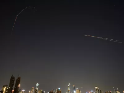 Israeli air defense system fires to intercept missiles during an Iranian attack over Tel Aviv, Israel, early Tuesday, March 3, 2026. (AP Photo/Ohad Zwigenberg)