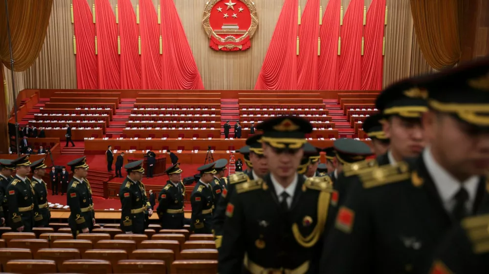 Military band members leave the venue following a rehearsal, before the opening session of the National People's Congress (NPC) at the Great Hall of the People in Beijing, China March 5, 2026. REUTERS/Florence Lo/Pool