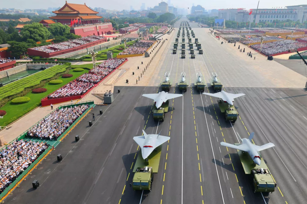 FILE - In this photo provided by China's Xinhua News Agency,In this photo released by Xinhua News Agency, drones and other armament formations pass during the military parade to commemorate the 80th anniversary of the end of World War II held in front of Tiananmen Gate in Beijing, Wednesday, Sept. 3, 2025. (Liu Xu/Xinhua via AP, File)
