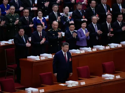 Chinese President Xi Jinping arrives for the opening session of the National People's Congress (NPC) in Beijing, Thursday, March 5, 2026. (AP Photo/Andy Wong)