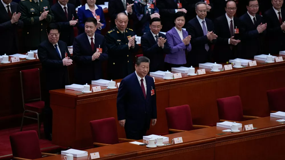Chinese President Xi Jinping arrives for the opening session of the National People's Congress (NPC) in Beijing, Thursday, March 5, 2026. (AP Photo/Andy Wong)