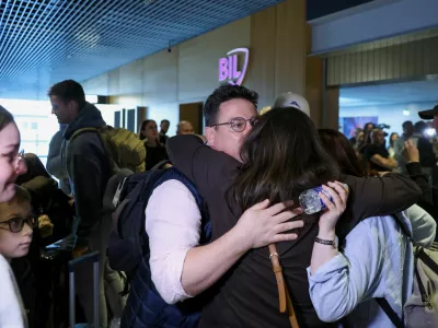 Passengers evacuated from the Middle East are greeted by family members upon their arrival from Muscat at Luxembourg Airport amid the U.S.-Israeli conflict with Iran, in Luxembourg, March 5, 2026. REUTERS/Omar Havana