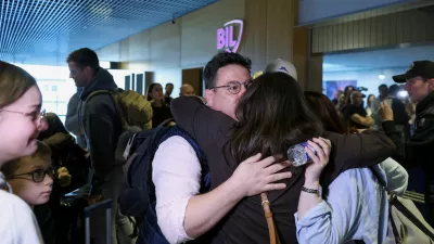 Passengers evacuated from the Middle East are greeted by family members upon their arrival from Muscat at Luxembourg Airport amid the U.S.-Israeli conflict with Iran, in Luxembourg, March 5, 2026. REUTERS/Omar Havana