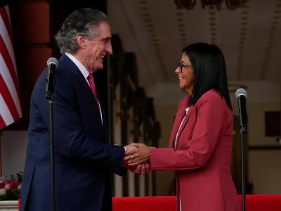 Venezuela's acting President Delcy Rodriguez, right, and U.S. Interior Secretary Doug Burgum shake hands after a meeting at Miraflores presidential palace in Caracas, Venezuela, Wednesday, March 4, 2026. (AP Photo/Ariana Cubillos)