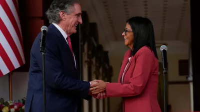 Venezuela's acting President Delcy Rodriguez, right, and U.S. Interior Secretary Doug Burgum shake hands after a meeting at Miraflores presidential palace in Caracas, Venezuela, Wednesday, March 4, 2026. (AP Photo/Ariana Cubillos)