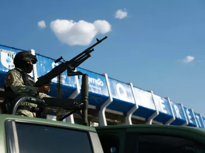 Soccer Football - International friendly - Mexico v Iceland - Estadio Corregidora, Santiago de Queretaro, Mexico - February 25, 2026 A member of the Mexican army with a gun outside the stadium before the match days after a wave of blockades and attacks by organized crime triggered by a Mexican military operation in which Jalisco New Generation Cartel leader Nemesio Oseguera, known as "El Mencho," was killed REUTERS/Raquel Cunha