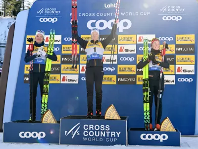 Winner Jonna Sundling of Sweden, center, second placed Linn Svahn of Sweden, left, and third placed Coletta Rydzek of Germany celebrate on the podium after the Cross-Country Skiing women's Sprint Free Style final at the FIS Nordic World Cup Lahti Ski Games in Lahti, Finland, Saturday March 7, 2026. (Emmi Korhonen/Lehtikuva via AP)
