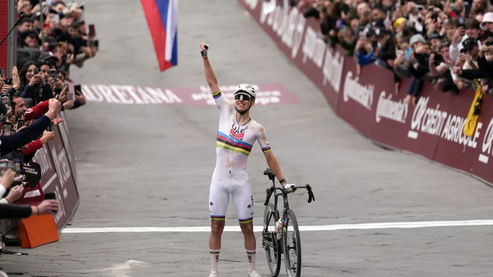 Tadej Pogacar of Team UAE Emirates celebrates winning the Strade Bianche (White Roads), a 203 km one day cycling race from and to Siena, Italy, Saturday March 7, 2026. (Fabio Ferrari/LaPresse via AP)