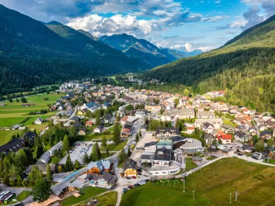 Kranjska Gora town in Slovenia at summer with beautiful nature and mountains in the background. View of mountain landscape next to Kranjska Gora in Slovenia, view from the top the town Kranjska Gora.