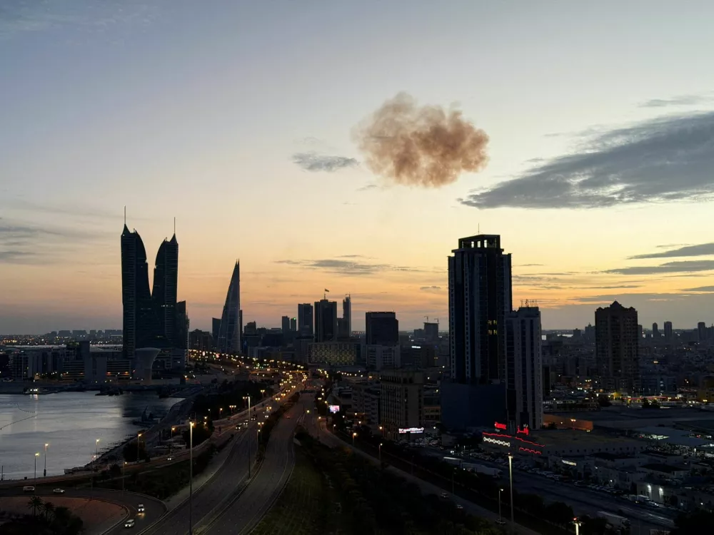 Smoke rises after an Iranian drone was intercepted over the Bahrain Financial Harbour towers, which houses the Israeli embassy, amid the U.S.-Israeli conflict with Iran, in Manama, Bahrain, March 6, 2026. Picture taken on a mobile phone. REUTERS/Stringer   TPX IMAGES OF THE DAY
