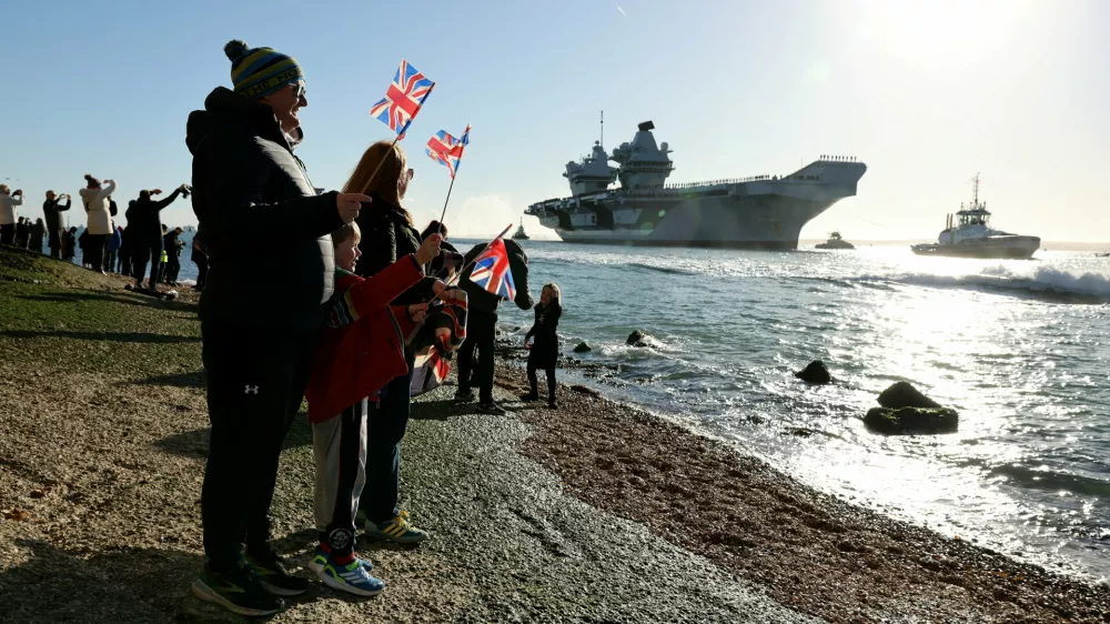 People gather to watch HMS Prince of Wales return home to Portsmouth, following an eight-month Indo-Pacific deployment as part of Operation Highmast, in Portsmouth, Britain November 30, 2025. UK MOD Crown/Ollie Leach/Handout via REUTERS THIS IMAGE HAS BEEN SUPPLIED BY A THIRD PARTY