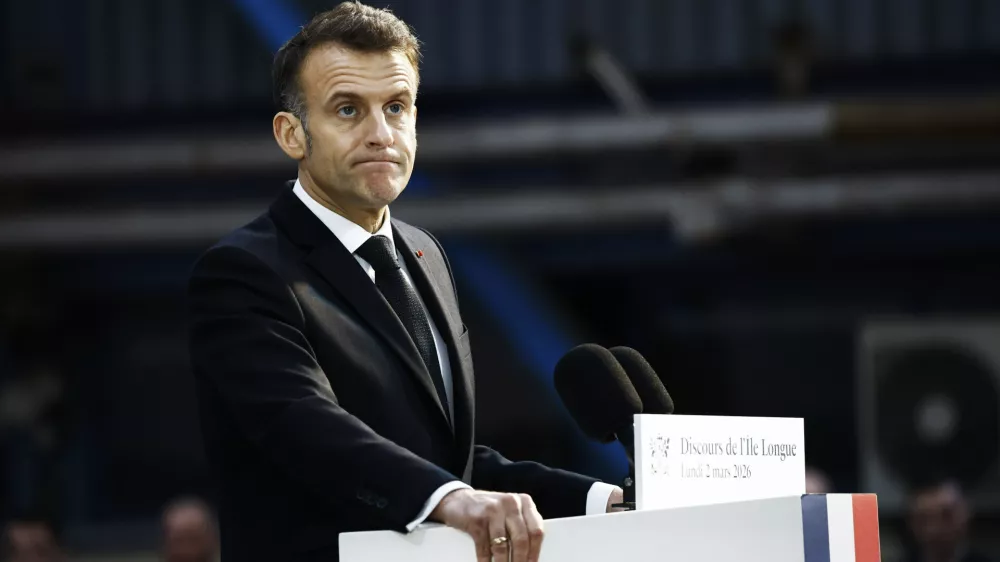 French President Emmanuel Macron delivers a speech next to the submarine 'Le Temeraire' (The Temerarious) at the Nuclear submarines Navy base of Ile Longue in Crozon, France, Monday March 2, 2026. (Yoan Valat/Pool Photo via AP)