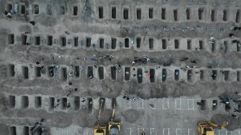Graves are being prepared for the victims following a reported strike on a school in Minab, Iran, March 2, 2026. Iranian Foreign Media Department/WANA (West Asia News Agency)/Handout via REUTERS ATTENTION EDITORS - THIS PICTURE WAS PROVIDED BY A THIRD PARTY. REFILE &ndash; REMOVING ATTRIBUTION TO STRIKE