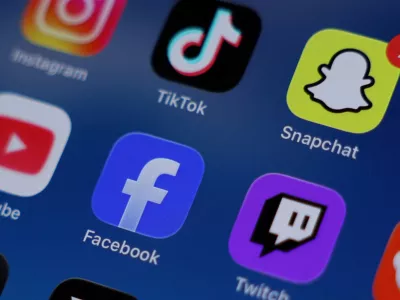 FILE PHOTO: Instagram, TikTok, Snapchat, YouTube, Facebook, Twitch and Reddit applications are displayed on a mobile phone ahead of new law banning social media for users under 16 in Australia, in this picture illustration taken on December 9, 2025. REUTERS/Hollie Adams/Illustration/File Photo