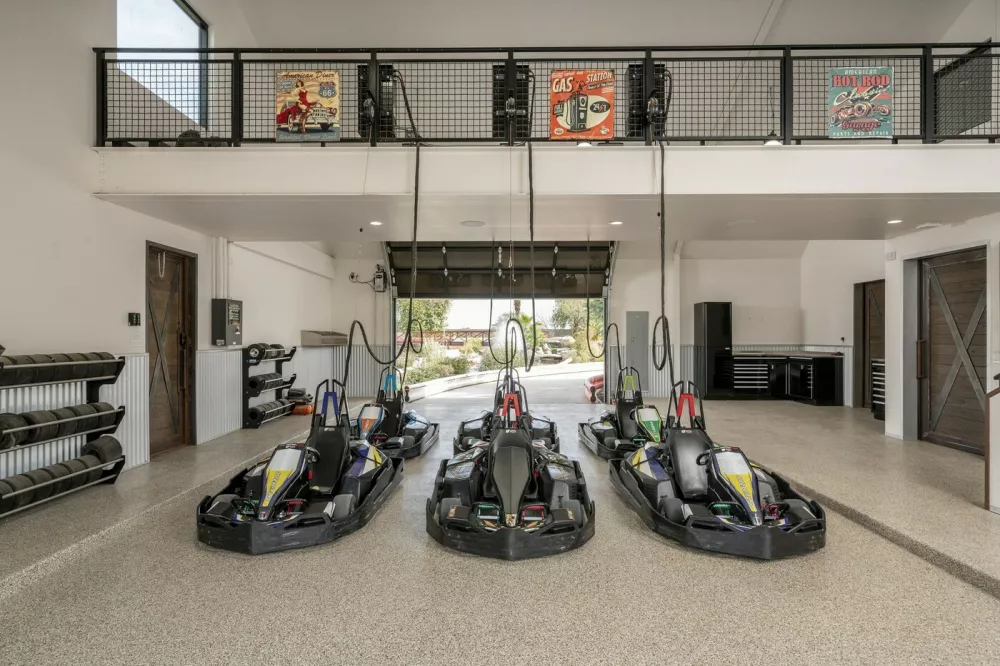 EXCLUSIVE: Story from Jam Press (Mega Bungalow Sale)Mega bungalow with own go-kart track and luxury man cave goes on sale for whopping Ł15mA jaw-dropping mega bungalow complete with its own go-kart track, underground shooting range and luxury man cave has hit the market for a staggering Ł15million.The eye-watering ranch-style pad boasts seven bedrooms and nine bathrooms &ndash; all spread across a sprawling 24,000 square feet of land.Described as the "ultimate sports and entertainment complex", the one-storey mansion is a playground for the super-rich.Built 23 years ago, the property comes with a six-car garage, a private cinema and even its own swimming pool.And if that wasn't enough, thrill-seekers can enjoy an underground shooting range and race mates on a private go-kart track.The mega-home is located in Gilbert, Maricopa County, Arizona, as reported by&nbsp;Luxury Property News.The lavish listing reads: "The main house has 9,326 square-feet of elegant living space with a six-stall garage and private movie theatre."The Hideaway Man Cave has 6,610 square-feet of entertainment/relaxation with a commercial kitchen, golf simulator, dance studio, batting cage, full fitness room and a studio apartment."The private day spa has 5,660 square-feet featuring a massage room, his-and-hers bathrooms, yoga room, hidden guest suite, dry sauna, steam room, spa shower and hot tub."The Go-Kart track is complete with six electric go-karts for endless outdoor fun."The underground shooting range has a two-lane, 185 foot-long gun range with a walk-in armoury."There is a Zen garden or greenhouse with perfectly manicured spaces for peace and tranquility."And an exotic animal enclosure, Koi ponds, baseball and full basketball court."The luxury estate is on sale with agents Compass for a cool 0million (Ł15million) &ndash; meaning only the deepest of pockets need apply.ENDSEDITOR'S NOTE:&nbsp;Video Usage Licence: (PROFESSIONAL.24 Feb 2026Pictured: Story from Jam Press (Mega Bungalow Sale)Mega bungalow with own go-kart track and luxury man cave goes on sale for whopping Ł15mA jaw-dropping mega bungalow complete with its own go-kart track, underground shooting range and luxury man cave has hit the market for a staggering Ł15million.The eye-watering ranch-style pad boasts seven bedrooms and nine bathrooms &ndash; all spread across a sprawling 24,000 square feet of land.Described as the "ultimate sports and entertainment complex", the one-storey mansion is a playground for the super-rich.Built 23 years ago, the property comes with a six-car garage, a private cinema and even its own swimming pool.And if that wasn't enough, thrill-seekers can enjoy an underground shooting range and race mates on a private go-kart track.The mega-home is located in Gilbert, Maricopa County, Arizona, as reported by&nbsp;Luxury Property News.The lavish listing reads: "The main house has 9,3.,Image: 1077930395, License: Rights-managed, Restrictions: NO Australia, Germany, Norway, South Korea, Sweden, United Kingdom, United States, Unknown Country, Model Release: no, Pictured: The incredible home for sale in Gilbert, Arizona