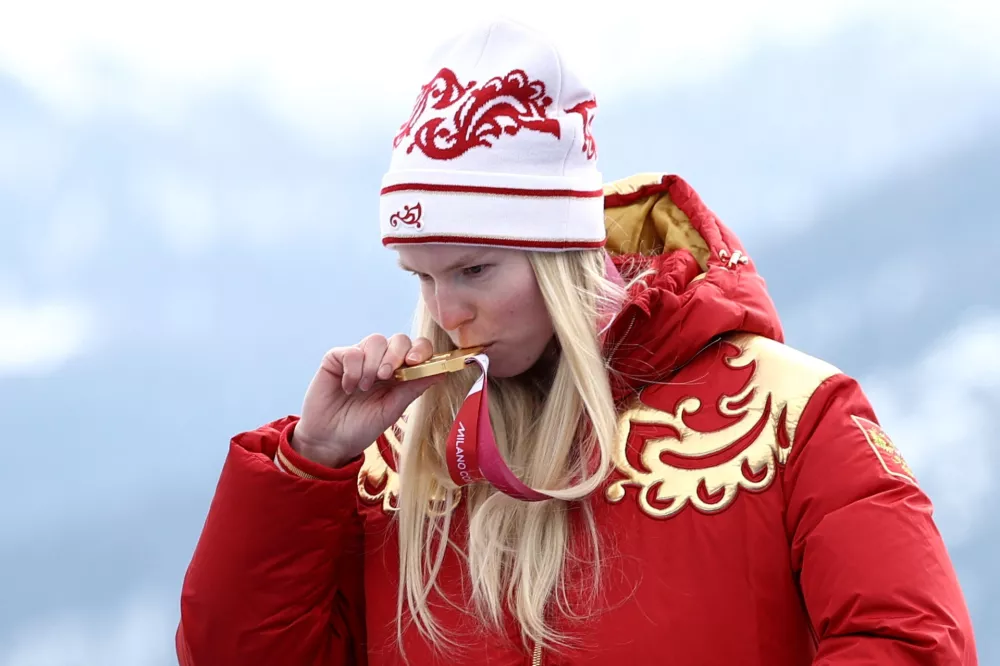 Milano Cortina 2026 Paralympics - Para Alpine Skiing - Women's Super-G Standing Victory Ceremony - Tofane Alpine Skiing Centre, Belluno, Italy - March 09, 2026. Gold medallist Varvara Voronchikhina of Russia celebrates on the podium during the women's super-g standing victory ceremony REUTERS/Stoyan Nenov
