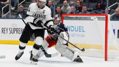 Columbus Blue Jackets' Jet Greaves, right, deflects the puck away from Los Angeles Kings' Anze Kopitar during the second period of an NHL hockey game, Monday, March 9, 2026, in Columbus, Ohio. (AP Photo/Jay LaPrete)
