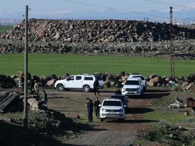 Turkish army and security personnel search a field after a piece of ammunition fell following the interception of a missile launched from Iran by a NATO air‑defence system, in Diyarbakir, Turkey, March 9, 2026. REUTERS/Sertac Kayar