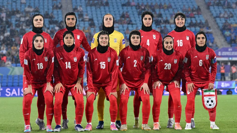 Iran players pose prior to the AFC Women's Asian Cup Group A match between Iran and Philippines at Gold Coast Stadium on the Gold Coast, Australia, March 8, 2026. Dave Hunt/AAP Image/via REUTERS  ATTENTION EDITORS - THIS IMAGE WAS PROVIDED BY A THIRD PARTY. NO RESALES. NO ARCHIVE. AUSTRALIA OUT. NEW ZEALAND OUT. NO COMMERCIAL OR EDITORIAL SALES IN NEW ZEALAND. NO COMMERCIAL OR EDITORIAL SALES IN AUSTRALIA. EDITORIAL USE ONLY.