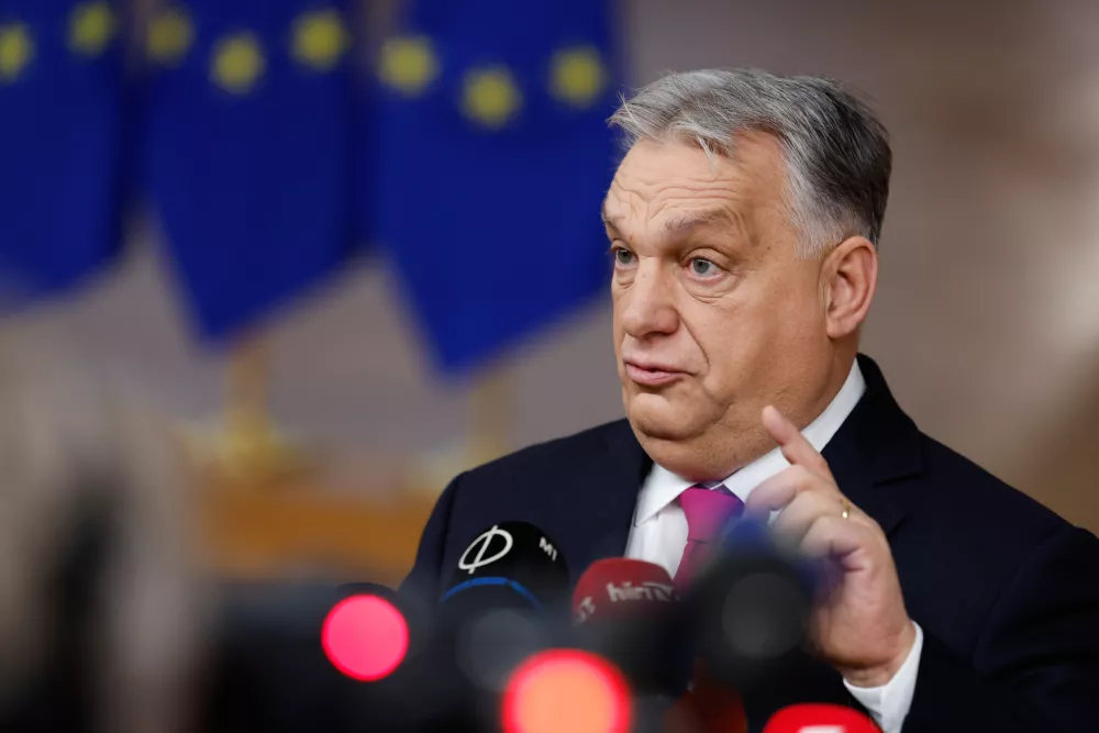 Hungary's Prime Minister Viktor Orban speaks with the media as he arrives for the EU Summit in Brussels, Thursday, Dec. 18, 2025. (AP Photo/Geert Vanden Wijngaert)
