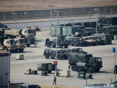 A U.S. army soldier walks past military vehicles at a U.S army base in Pyeongtaek, South Korea, March 10, 2026.  REUTERS/Kim Hong-Ji