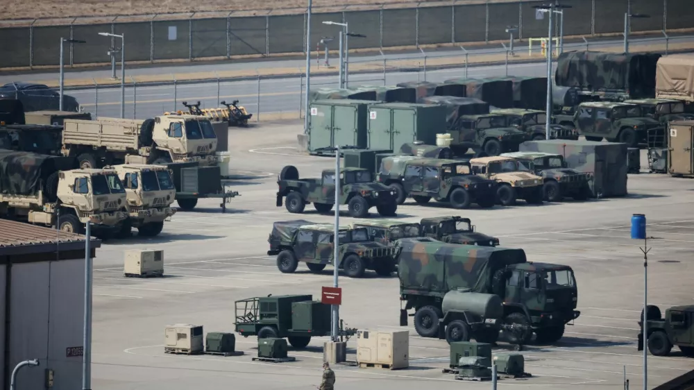 A U.S. army soldier walks past military vehicles at a U.S army base in Pyeongtaek, South Korea, March 10, 2026.  REUTERS/Kim Hong-Ji