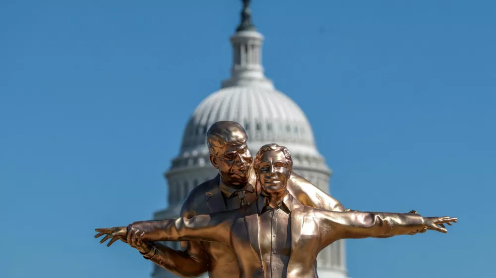 People look at a statue depicting U.S. President Donald Trump and convicted sex offender Jeffrey Epstein, entitled "The King of the World", on the National Mall in Washington, D.C., U.S., March 10, 2026. REUTERS/Evelyn Hockstein   TPX IMAGES OF THE DAY