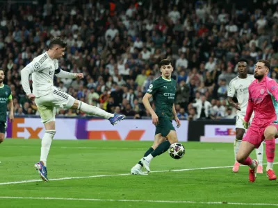 Soccer Football - UEFA Champions League - Round of 16 - First Leg - Real Madrid v Manchester City - Santiago Bernabeu, Madrid, Spain - March 11, 2026 Real Madrid's Federico Valverde scores their third goal to complete a hat-trick REUTERS/Violeta Santos Moura
