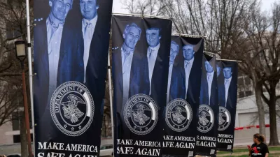 Banners with a photograph of President Donald Trump and Jeffrey Epstein are seen on the National Mall, Wednesday, March 11, 2026, in Washington. (AP Photo/Jose Luis Magana)