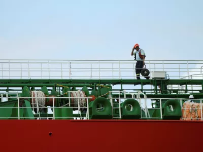 A crew member walks on the deck of the Marshall Islands-flagged oil tanker Atlantic Rainbow as it transits the Panama Canal, after the interoceanic waterway reported a 2.8% increase in vessel transits in the first four months of its fiscal year through January, according to the canal authority, in Panama City, Panama, March 11, 2026. REUTERS/Enea Lebrun