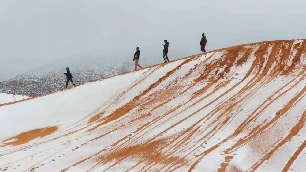 *NO UK* Snow covered sand dunes in the Sahara Desert after temperatures dropped below freezing near the town of Ain Sefra in northwestern Algeria. Photographer Karim Bouchetata captured images of the rare phenomenon in the Saharan town, known as the Gateway to the Desert, which sits around 1000 metres above sea level and is surrounded by the Atlas Mountains.Pictured: gv,general view,Image: 1082022226, License: Rights-managed, Restrictions: -GBR, Model Release: no, Pictured: gv,general view