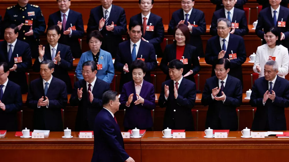 Chinese President Xi Jinping arrives for the closing session of the National People's Congress (NPC) at the Great Hall of the People in Beijing, China March 12, 2026. REUTERS/Tingshu Wang