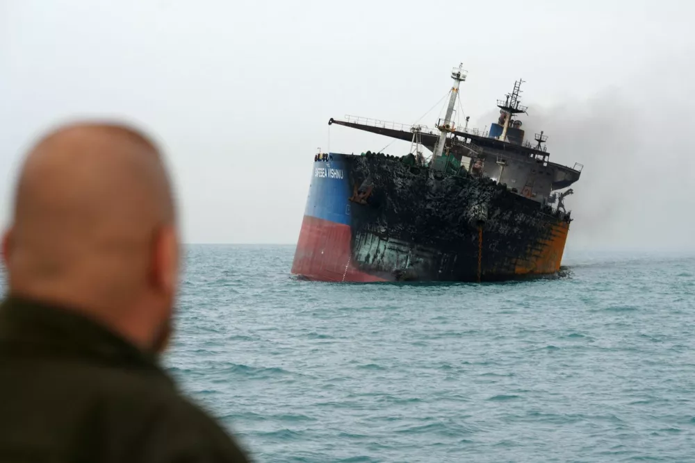 A foreign tanker carrying Iraqi fuel oil damaged after catching fire in Iraq's territorial waters, following unidentified attacks that targeted two foreign tankers, according to Iraqi port officials, near Basra, Iraq, March 12, 2026. REUTERS/Mohammed Aty