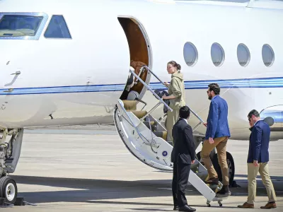 This photo released by the state-run WAM news agency shows U.S.-Russian dual national Ksenia Karelina getting on a private jet after her release at an airport in Abu Dhabi, United Arab Emirates, Thursday, April 10, 2025. (WAM via AP)