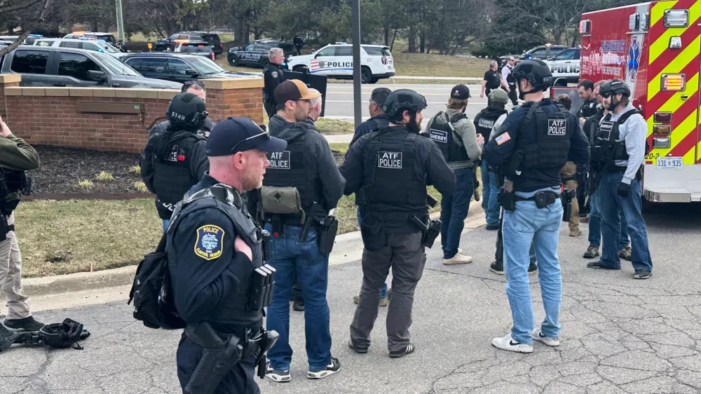 Law enforcement respond to a call at Temple Israel synagogue on Thursday, March 12, 2026, in West Bloomfield Township, Mich. (AP Photo/Corey Williams)