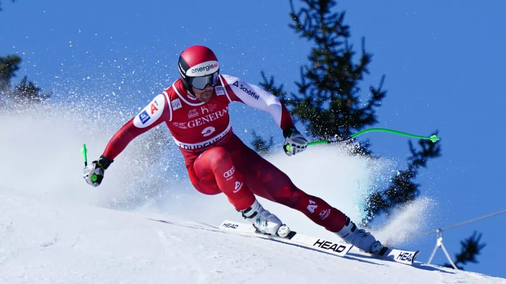 Austria's Vincent Kriechmayr speeds down the course during an alpine ski, men's World Cup downhill race, in Courchevel, France, Friday, March 13, 2026. (AP Photo/Pier Marco Tacca)