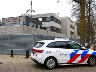 A police vehicle outside a Jewish school following an explosion that caused minor damages, in Amsterdam, Netherlands, March 14, 2026. REUTERS/Piroschka van de Wouw