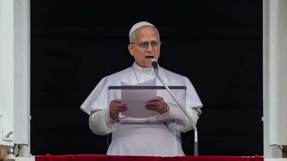 Pope Leo XIV appears at the window of his studio overlooking St. Peter's Square at the Vatican where Catholic faithful and pilgrims gathered for the traditional Sunday blessing at the end of the noon Angelus prayer, Sunday, March 15, 2026. (AP Photo/Andrew Medichini)