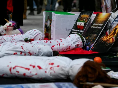 A makeshift memorial for the victims of a strike on an Iranian girls' school that killed scores of children, at a protest marking Al-Quds Day and opposing the war on Iran and Lebanon outside the U.S. consulate in Toronto, Ontario, Canada, March 14, 2026. REUTERS/Laura Proctor