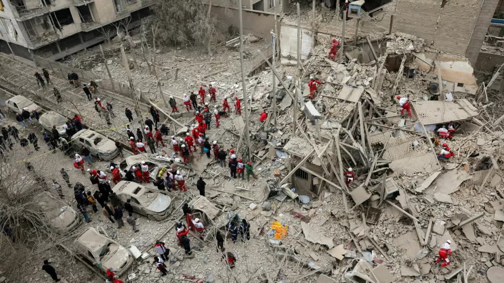 Emergency personnel work at the site of a strike on a residential building, amid the U.S.-Israeli conflict with Iran, in Tehran, Iran, March 16, 2026. Majid Asgaripour/WANA (West Asia News Agency) via REUTERS ATTENTION EDITORS - THIS PICTURE WAS PROVIDED BY A THIRD PARTY   TPX IMAGES OF THE DAY