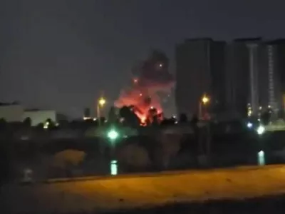 Smoke and fire rise during reported drone and rocket strikes at the U.S. embassy, according to Iraqi security sources, in Baghdad, Iraq, in this still image obtained from a social media video released on March 17, 2026. Social Media via REUTERS THIS IMAGE HAS BEEN SUPPLIED BY A THIRD PARTY. NO RESALES. NO ARCHIVES. NEWS USE ONLY. TPX IMAGES OF THE DAY    VERIFICATION: Reuters was able to confirm the location from buildings, road layout, water body, the construction crane and the pillar of the restaurant which matched file and satellite image. The strike happened within the vicinity of coordinates at 33.29897989833943, 44.38517051381258. Exact time was not verified but no older version of the video was found posted online before March 17. Security sources confirmed that drones and rockets attacked the US embassy in Baghdad on March 17.
