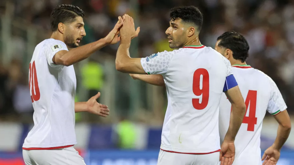 FILE PHOTO: Soccer Football - World Cup - Asian Qualifiers - Group A - Iran v North Korea - Azadi Stadium, Tehran, Iran - June 10, 2025 Iran's Mehdi Taremi celebrates scoring their second goal with Mohammad Mohebi Majid Asgaripour/WANA (West Asia News Agency) via REUTERS  ATTENTION EDITORS - THIS IMAGE HAS BEEN SUPPLIED BY A THIRD PARTY./File Photo