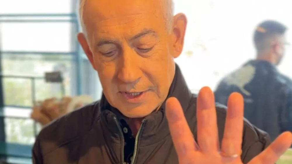 Israeli Prime Minister Benjamin Netanyahu shows his hand as he speaks at a cafe, amid the U.S.-Israeli conflict with Iran, in Jerusalem, March 15, 2026, in this screen grab taken from a handout video. Benjamin Netanyahu via Telegram/Handout via REUTERS  THIS IMAGE HAS BEEN SUPPLIED BY A THIRD PARTY. NO RESALES. NO ARCHIVES. MANDATORY CREDIT. TEXT OVERLAY FROM SOURCE. VERIFICATION: - Cafe interiors matched file imagery of the area. - Date verified by multiple corroborating videos and photos posted by the cafe on March 15. - No older versions of the video were found posted online before March 15. - Coordinates: 31.775368725805468, 35.12722970081208