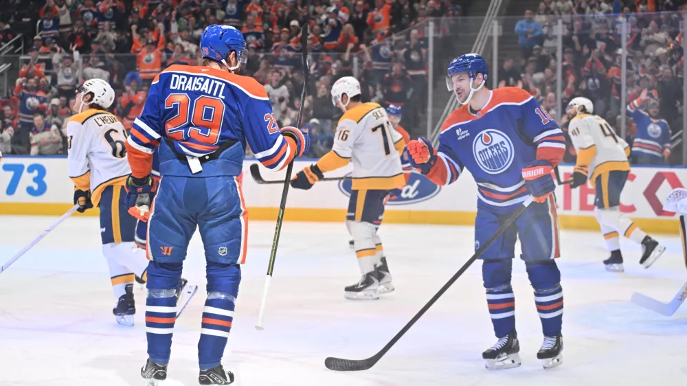 Mar 15, 2026; Edmonton, Alberta, CAN; Edmonton Oilers center Leon Draisaitl (29) and Oilers left wing Zach Hyman (18) celebrate a goal on Nashville Predators goalie Justus Annunen (29) during the first period at Rogers Place. Mandatory Credit: Walter Tychnowicz-Imagn Images