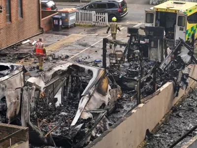 View at burnt ambulances in a car park at Golders Green in London, Monday, March 23, 2026 after an apparent arson attack on four vehicles belonging to a Jewish ambulance service, Hatzola Northwest.(AP Photo/Alberto Pezzali)