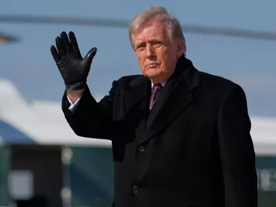 President Donald Trump waves after arriving on Air Force One, Wednesday, March 18, 2026, at Joint Base Andrews, Md., after attending the casualty return at Dover Air Force Base, Del., for the six crew members of an Air Force refueling aircraft who died when their plane crashed in western Iraq while supporting operations against Iran. (AP Photo/Julia Demaree Nikhinson)