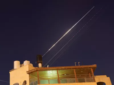 An Iranian missile with cluster munitions flies towards Israel, amid the U.S.-Israeli conflict with Iran, as seen from Hebron, in the Israeli-occupied West Bank, March 18, 2026. Picture taken with a long exposure. REUTERS/Mussa Qawasma