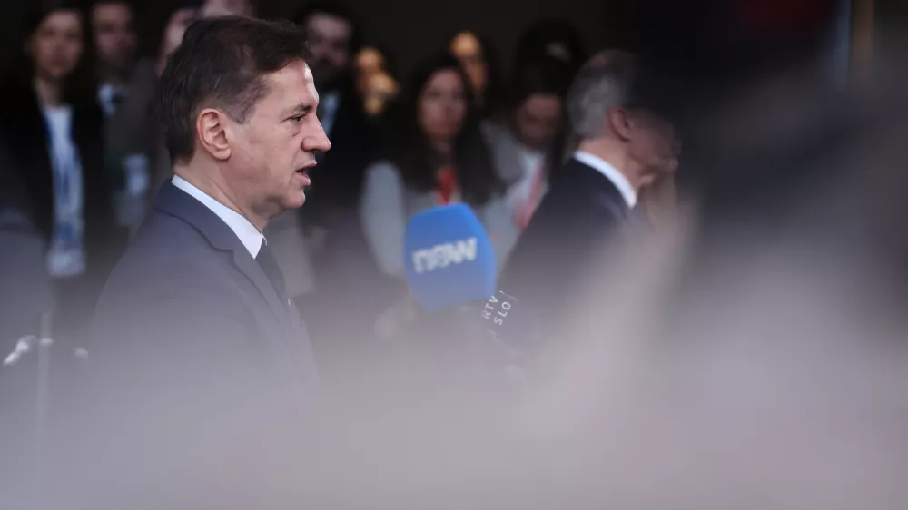 Slovenia's Prime Minister Robert Golob speaks with the media as he arrives for the EU summit at the European Council building in Brussels, Thursday, March 19, 2026. (AP Photo/Omar Havana)